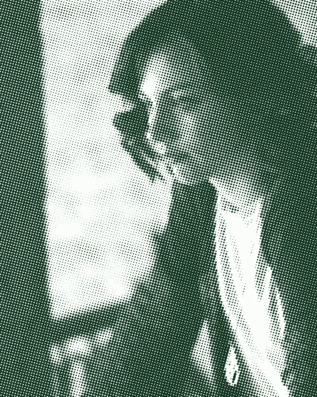 A person's face in profile, lit from the side.